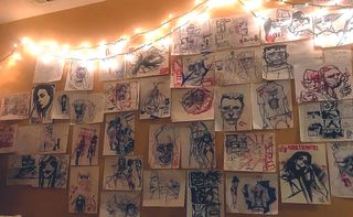 Artist in residence; a wall filled with sketches