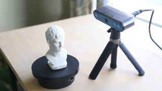 Using a 3D scanner to create a digital scan of a bust of a head, by Paul Hatton