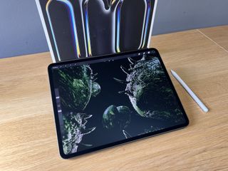 An Apple iPad Pro (M4, 2024) sitting on a wooden desk