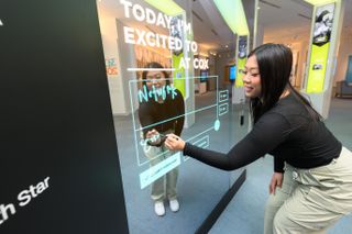 people interacting with museum exhibit