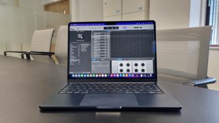 MacBook Air laptop in an office on a black desk