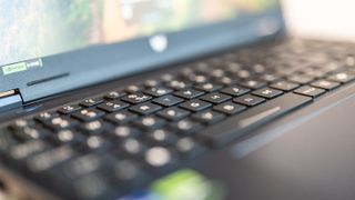 A black Acer Predator Helios Neo 16 gaming laptop on a white table