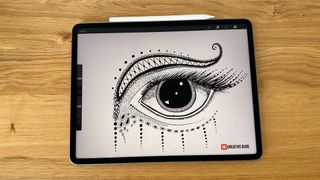 iPad Pro M2 on a desk with a drawing of an eye on the screen