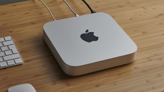 An Intel Mac mini on a desk wired to a monitor.