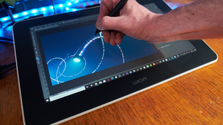 A person drawing on a Wacom One