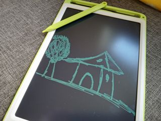 A green and white Richgv LCD Tablet with a green pen