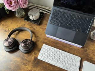 A brown wooden Maidesite TH2 Pro Plus desk in a bright home office