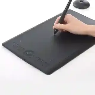 The Wacom Intuos Medium, being used by a hand.