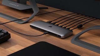 Corsair TBT200, one of the best docks for MacBook Pro, plugged in on wooden desk