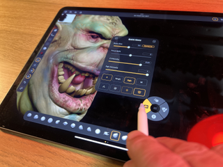 ZBrush for iPad review; a person using a 3D modelling app on an iPad