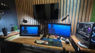 A home studio setup with computer screens