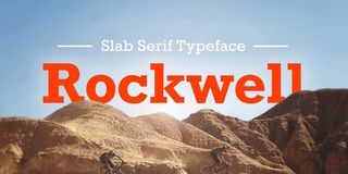 Slab serif typeface Rockwell, in red letters with mountains underneath it