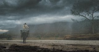 Making the invisible VFX of Horizon: An American Saga - Chapter 1; a man on a horse rides in the rain