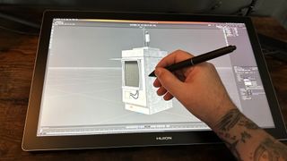 Huion Kamvas Pro 19 review; a person uses a pen display to create a 3D model