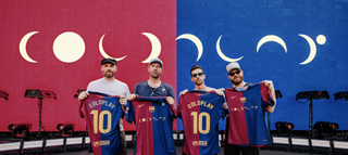 Coldplay holding Barcelona FC shirts