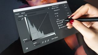 A Huion Kamvas Pro 27 drawing tablet in use on a desk