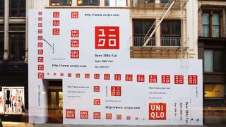 Uniqlo branding on hoarding covering store