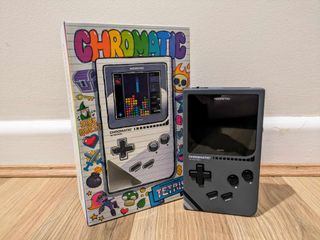 Modretro Chromatic review; a Game Boy like retro console on a wooden floor