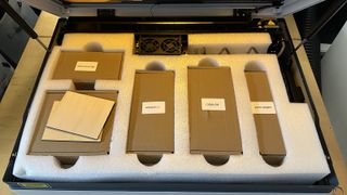 The wecreat vista laser cutter/engraver's accessories, packed in boxes and styrofoam.