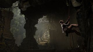 Indiana Jones and the Great Circle review; a man climbs down rocks in a cave