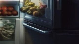 An image of a chef looking in a fridge that may be AI generated